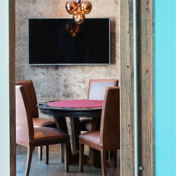 a dining room with a table and chairs