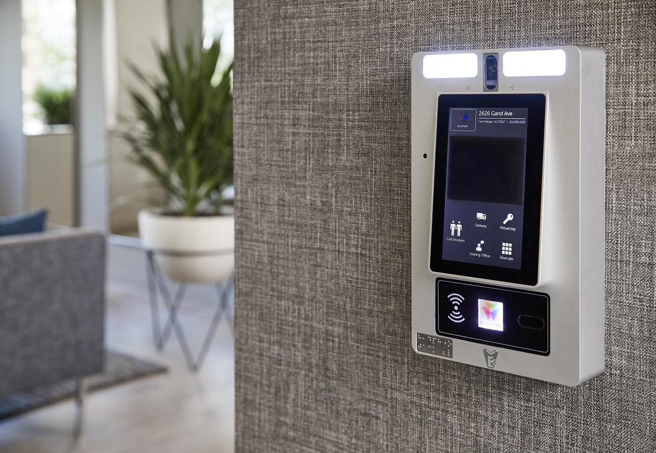 an iphone sitting on a wall in a living room