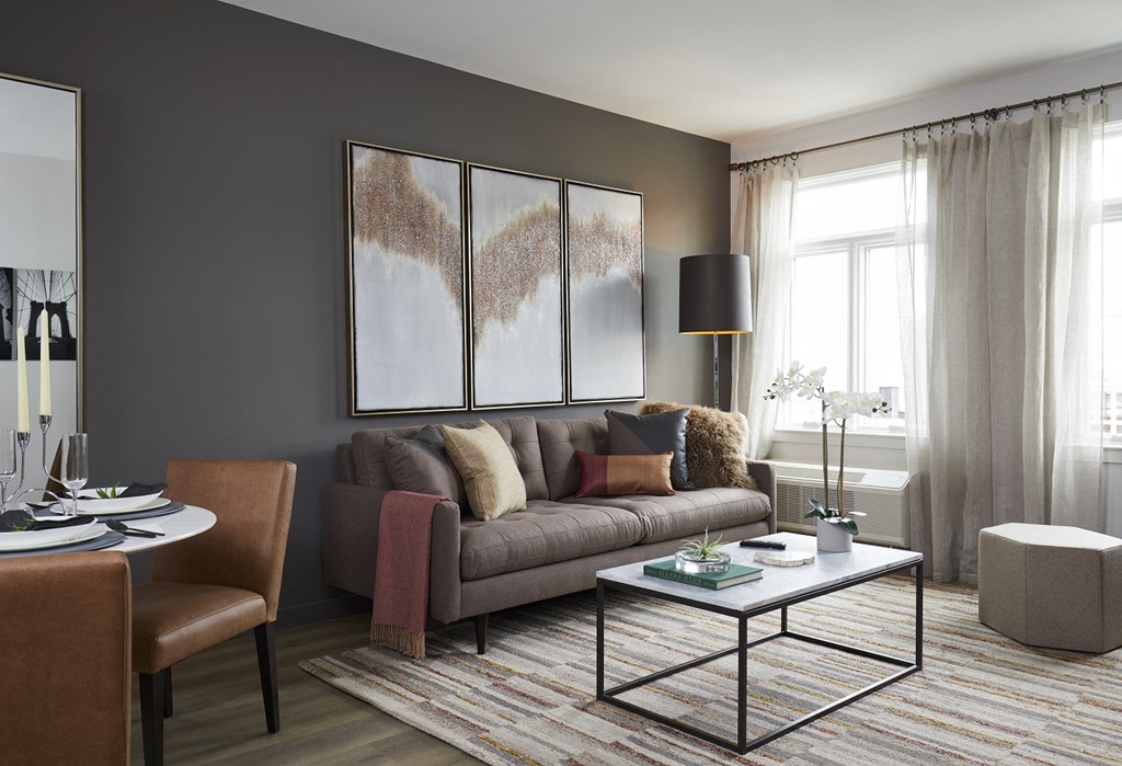 a living room with a couch and a table