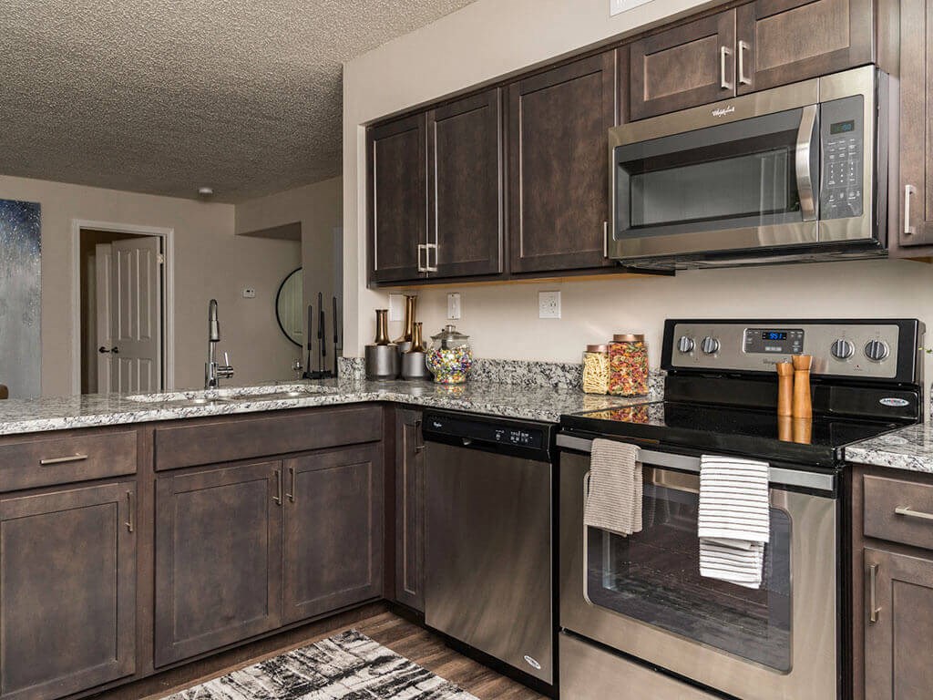 Fairlane Woods apartment kitchen with stainless steel appliances
