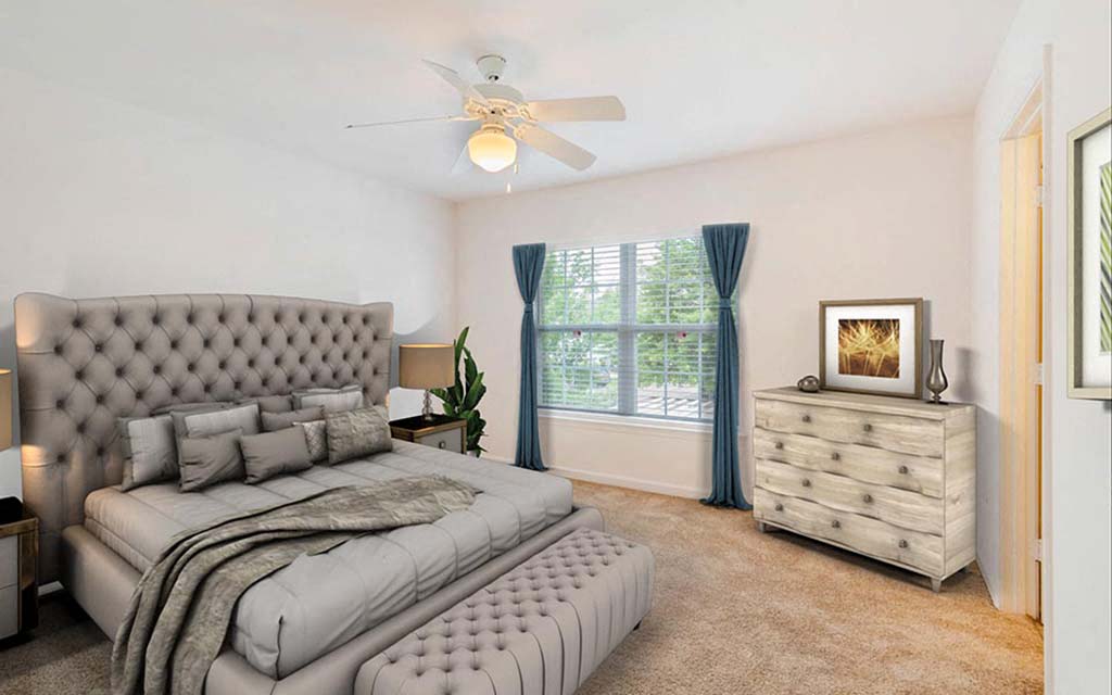 a bedroom with a bed and a ceiling fan