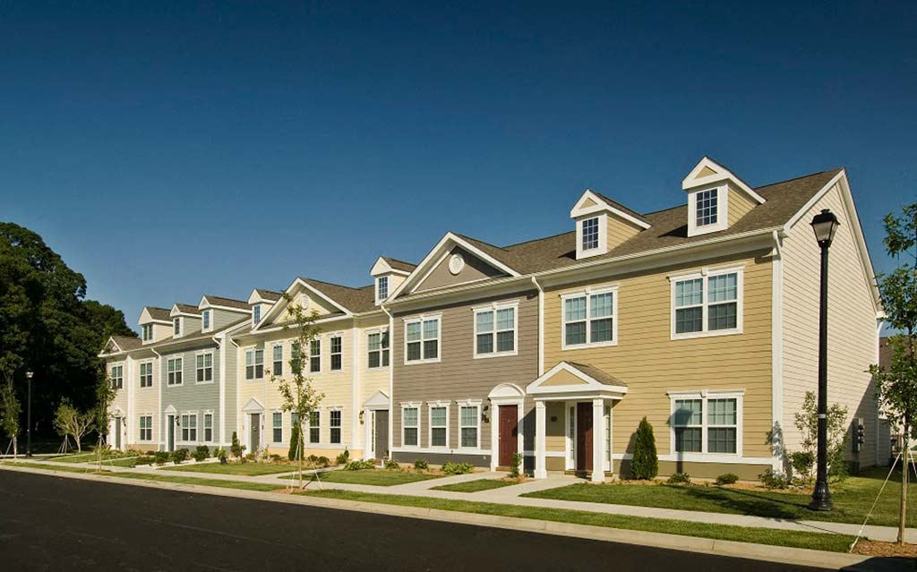 a row of houses on the side of a street