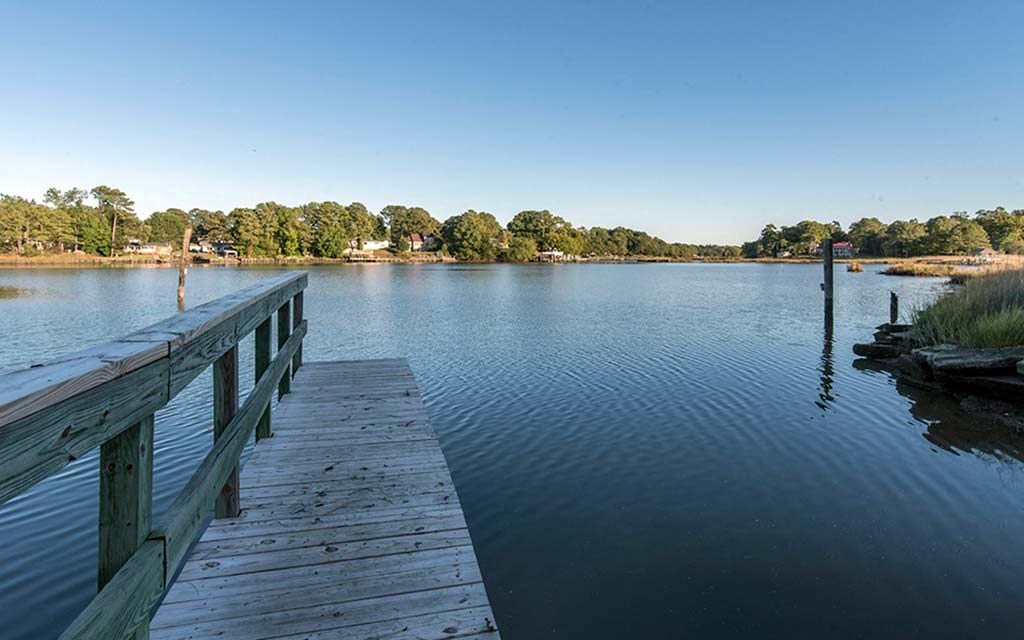 a dock on the water near a lake