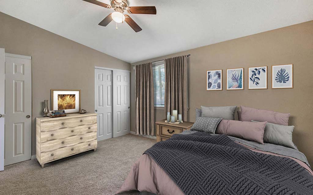 a bedroom with a bed and a ceiling fan