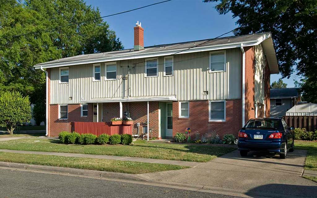 a house with a car parked in front of it