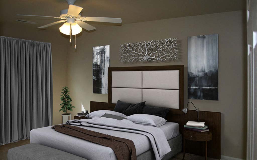 a bedroom with a bed and a ceiling fan