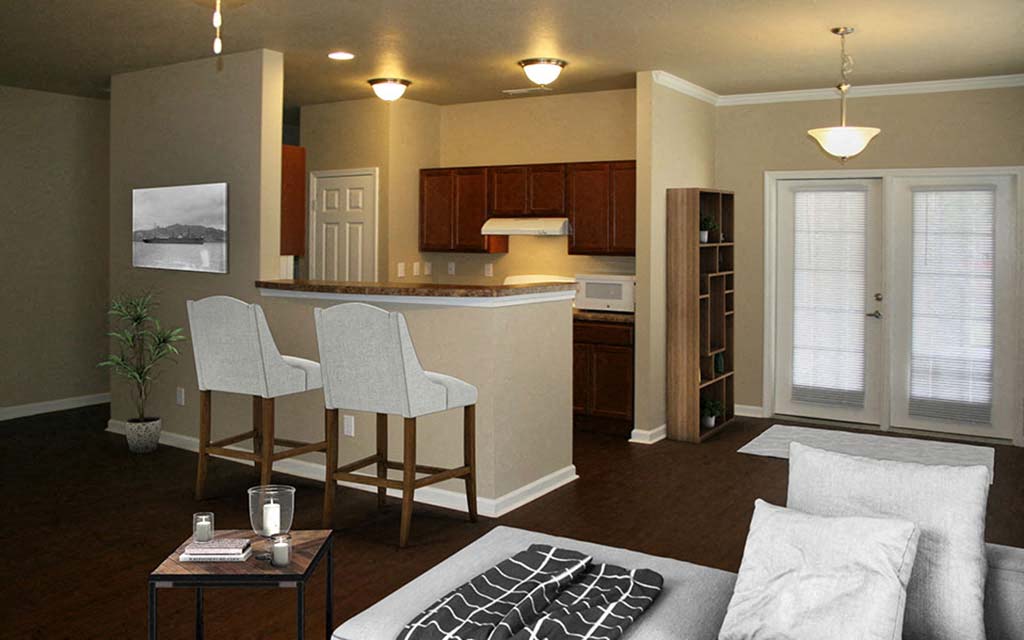 a living room with a kitchen and a couch