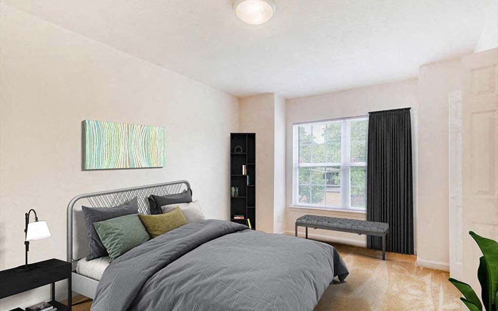 a bedroom with a bed and a window