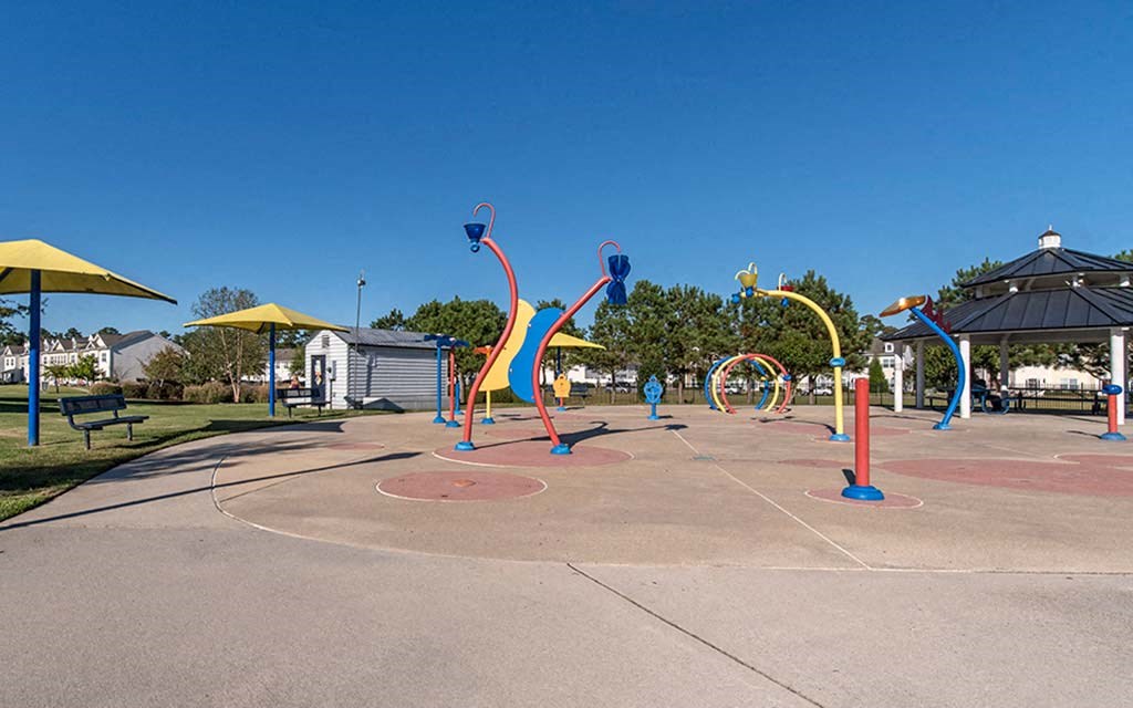 a playground with colorful structures in a park