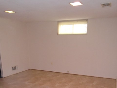A room with a window and a door.