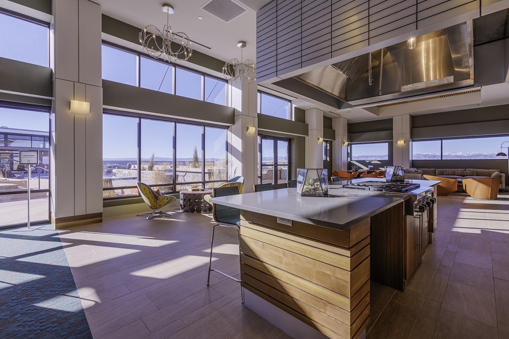a kitchen and living room with a view of the city