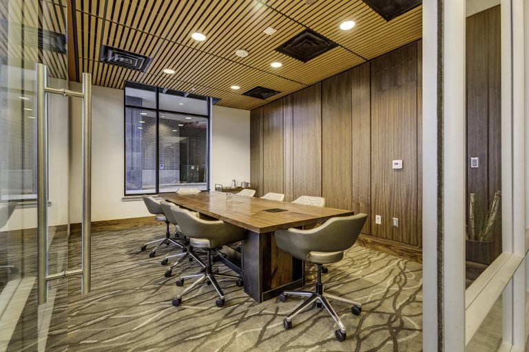 a conference room with a large table and chairs