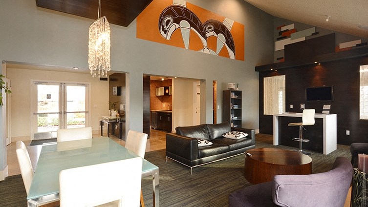 a view of a living room and dining room in a hotel suite