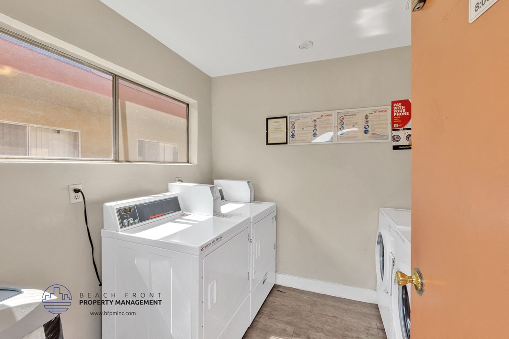 the laundry room has a washer and dryer and a window