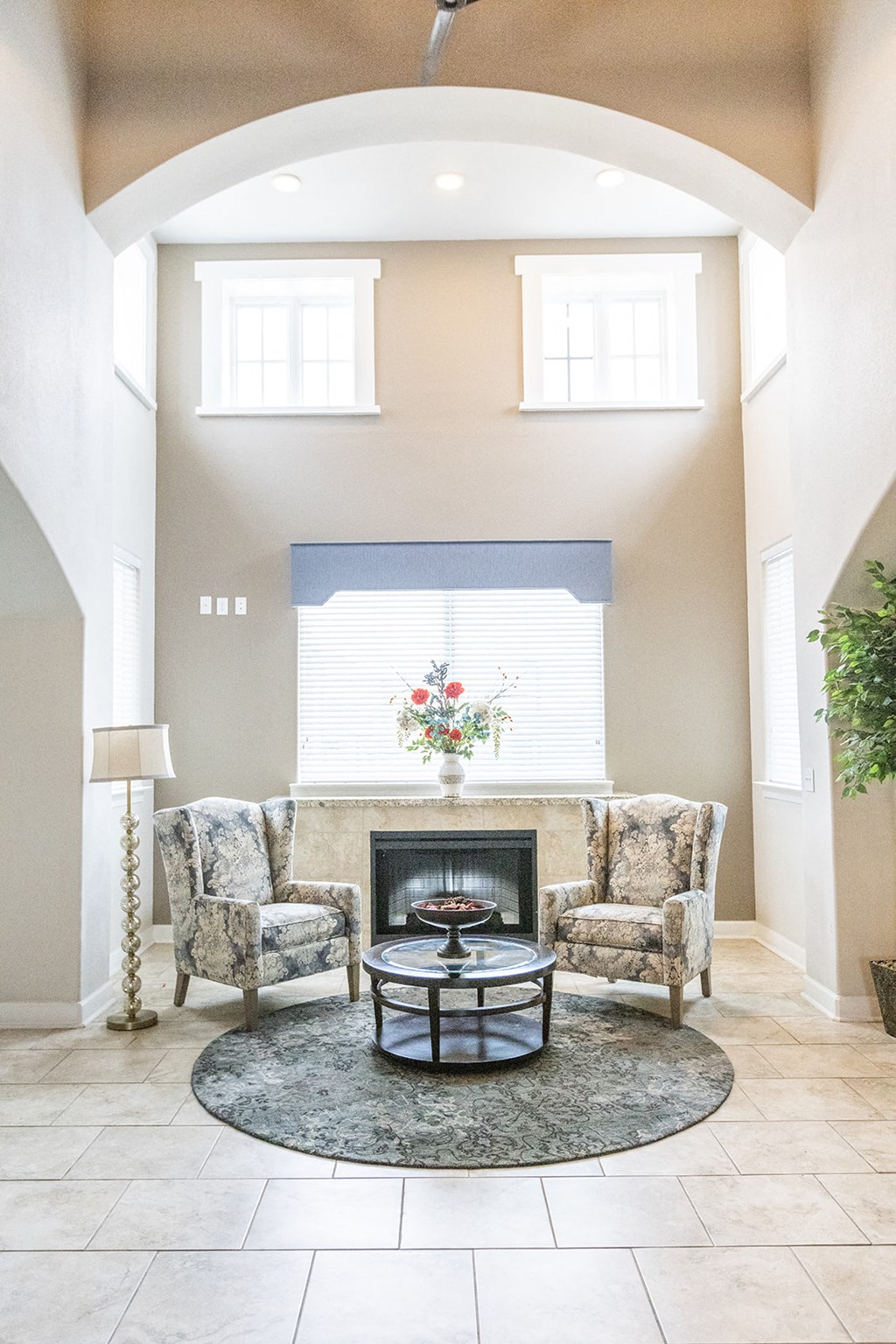 a living room with a couch and a fireplace