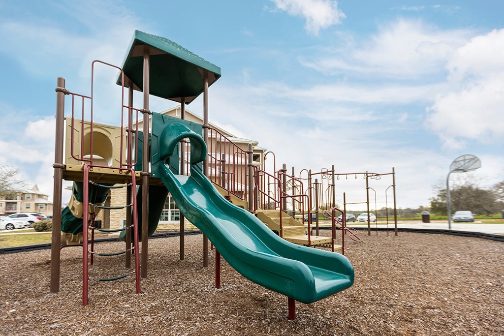 a playground with a slide and other play equipment