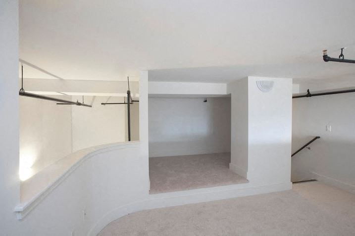 Top of the staircase of loft with alcove