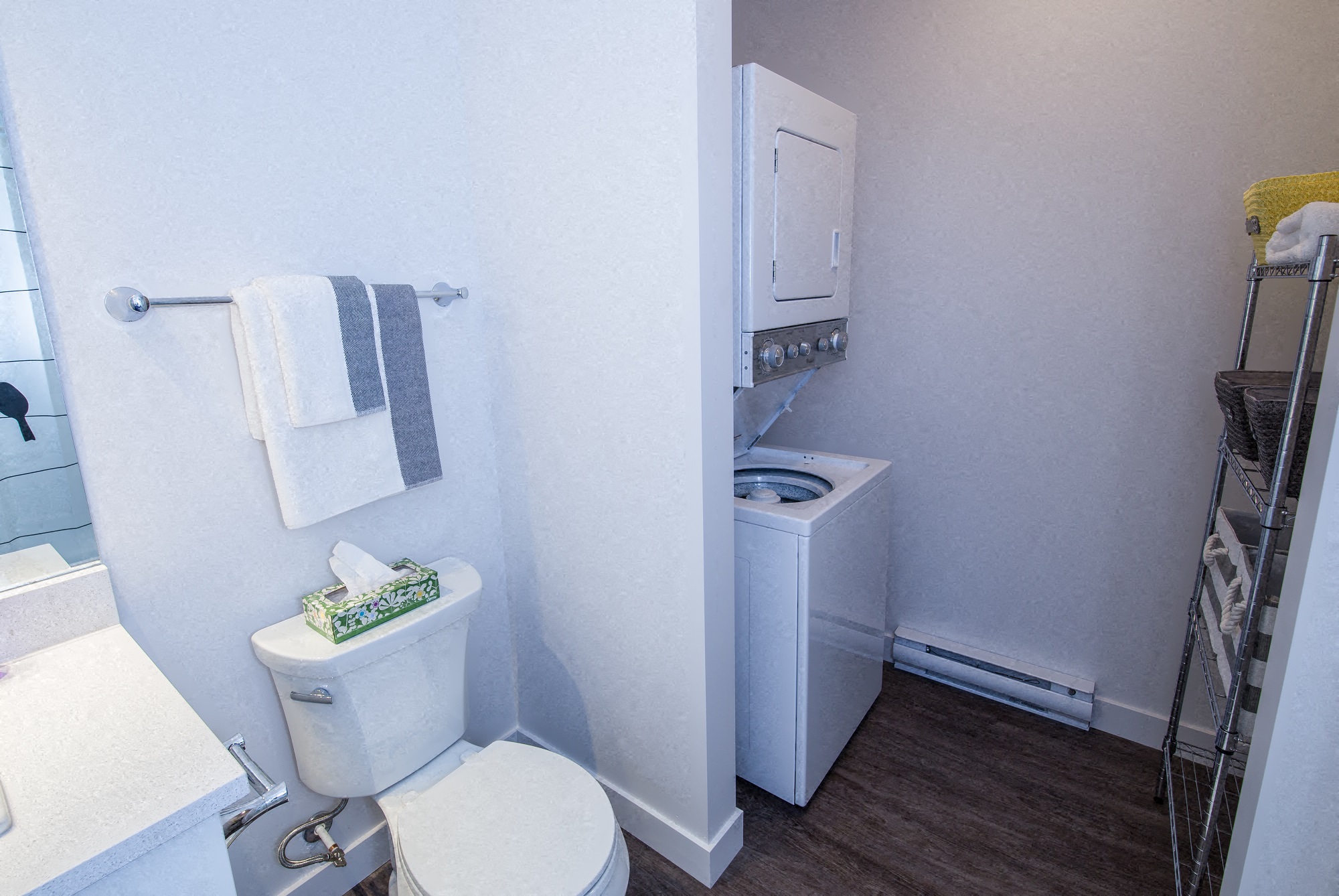a small bathroom with a toilet and a washing machine