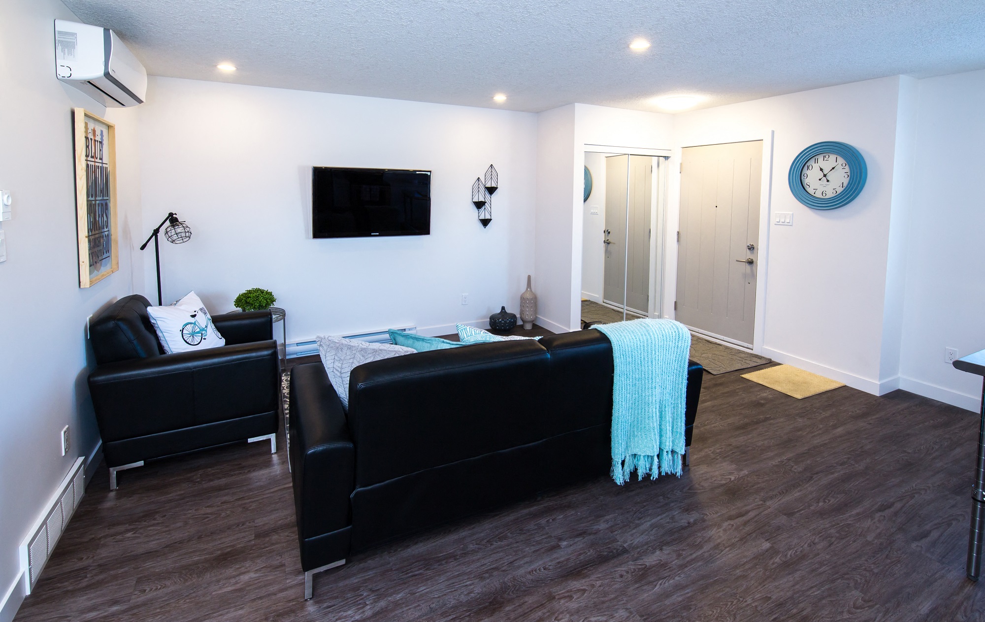 a living room with a couch and a tv