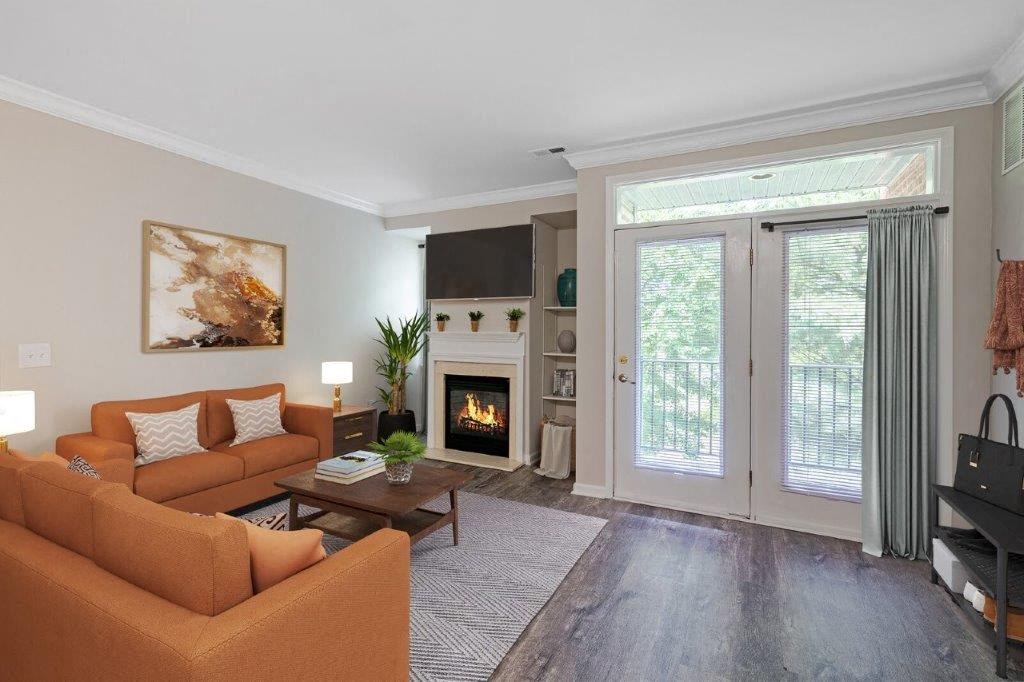 a living room with a couch and a fireplace