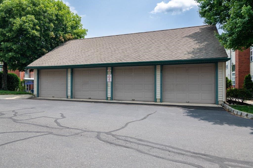 a car garage with green and white doors
