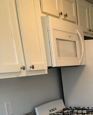 Kichen Kitchen with granite counters and white cabinets