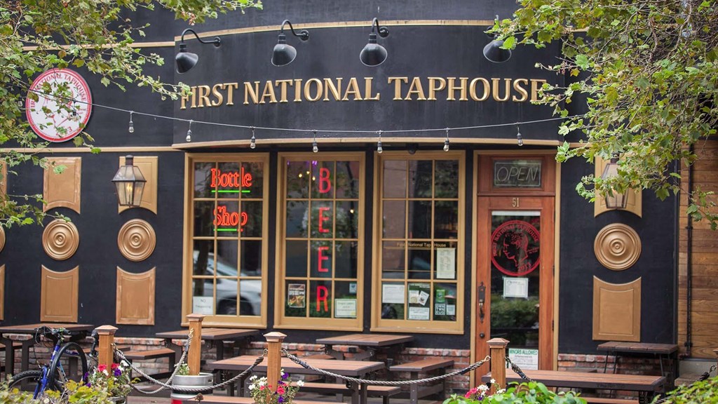 the front of a restaurant with a sign that reads first national tadpole