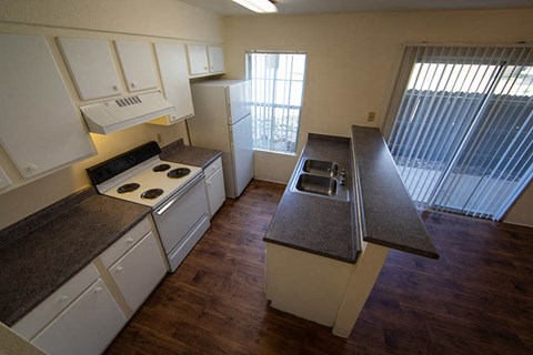 a kitchen with a stove and a sink