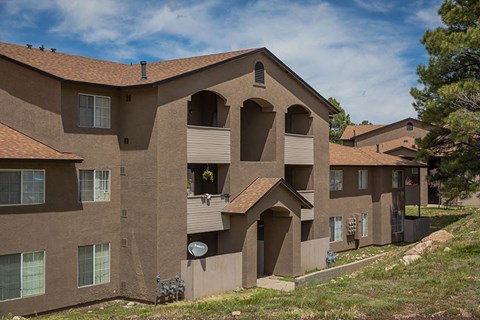 a large brown house with a window and a door