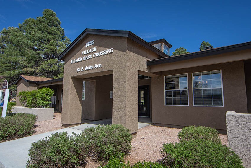 a brown building with a sign on the front of it