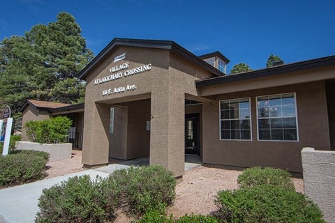 a brown building with a sign on the front of it