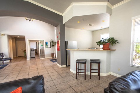 a living room with a bar and a couch