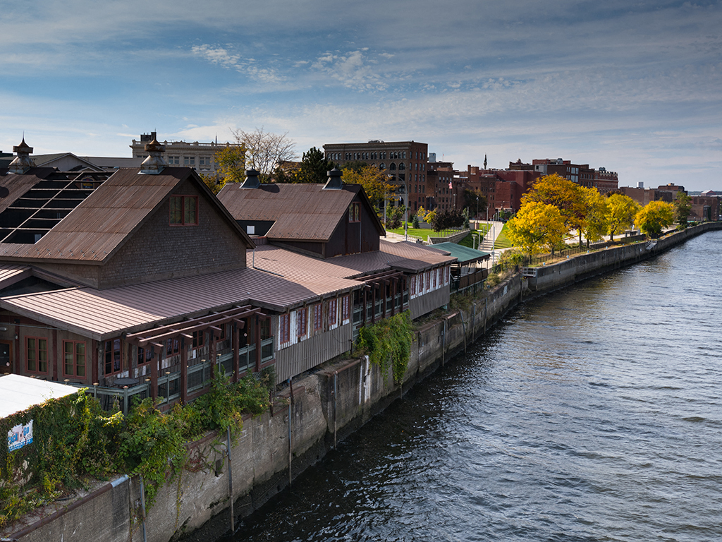 a river running through a city with buildings on the side