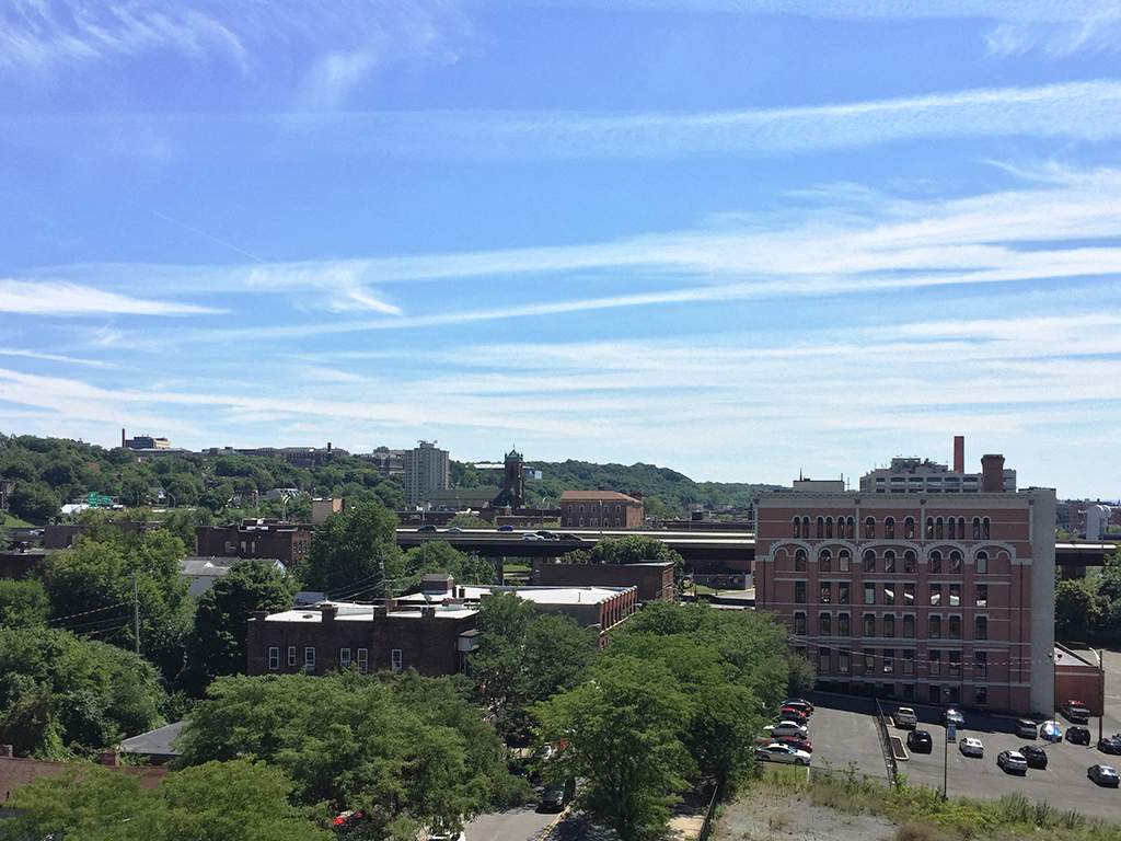 a view of the city from the roof of a building