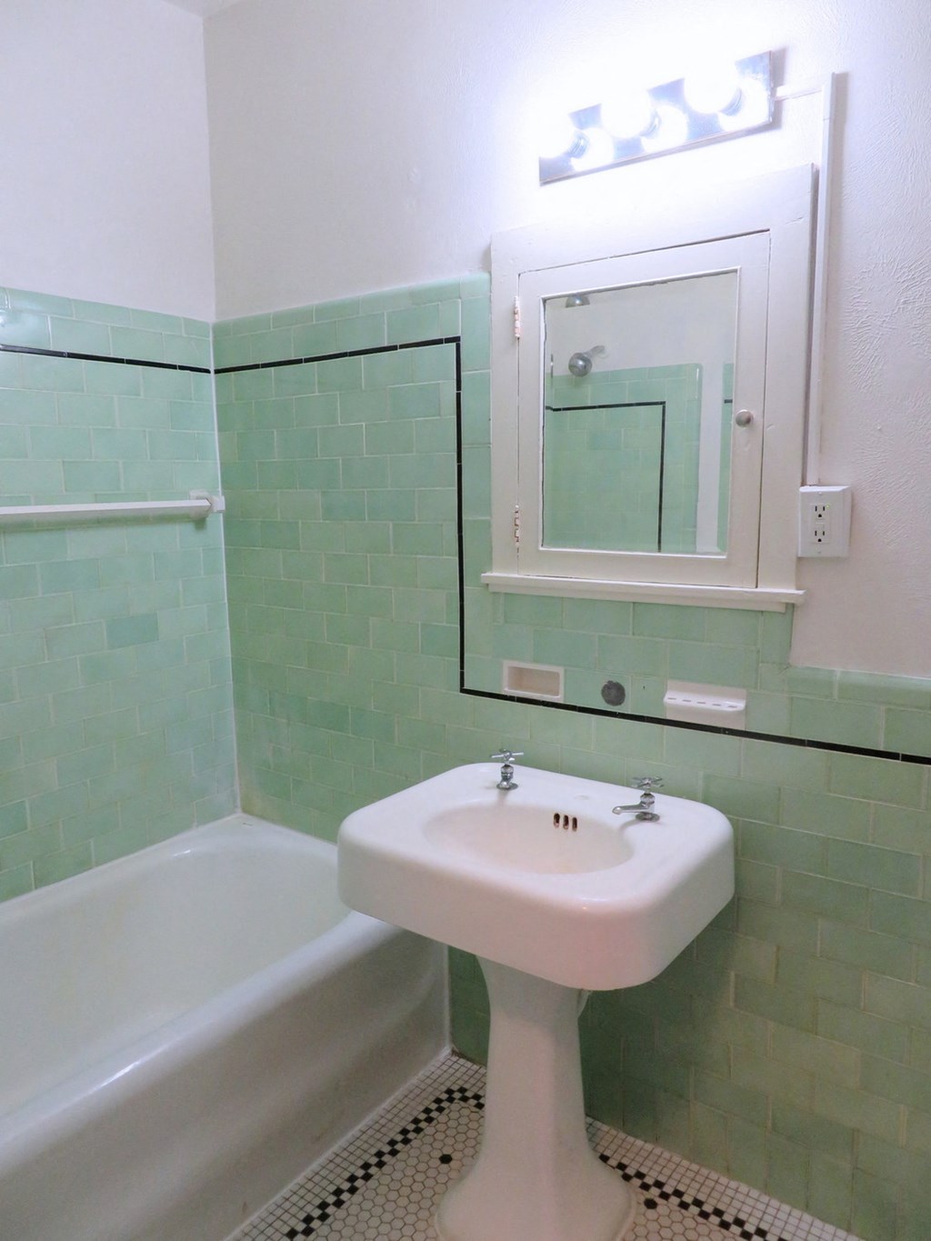 a bathroom with a sink and a bath tub