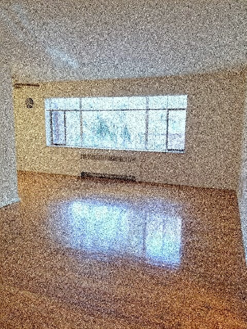 a reflection of a window on the floor of a room