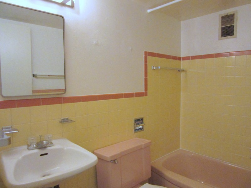 a bathroom with a sink and a toilet and a tub