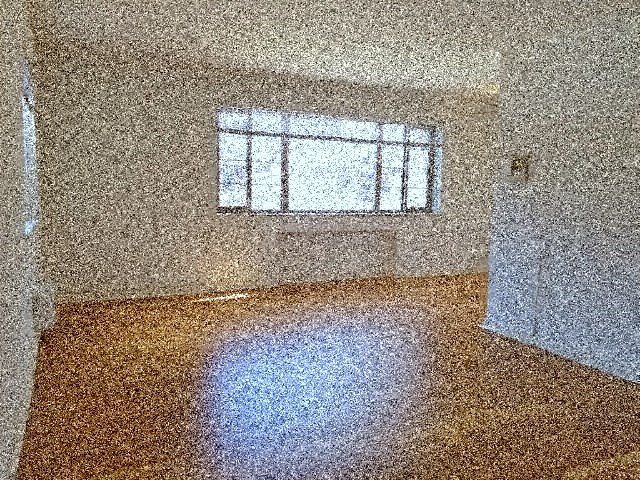 a small room with a window in the wall