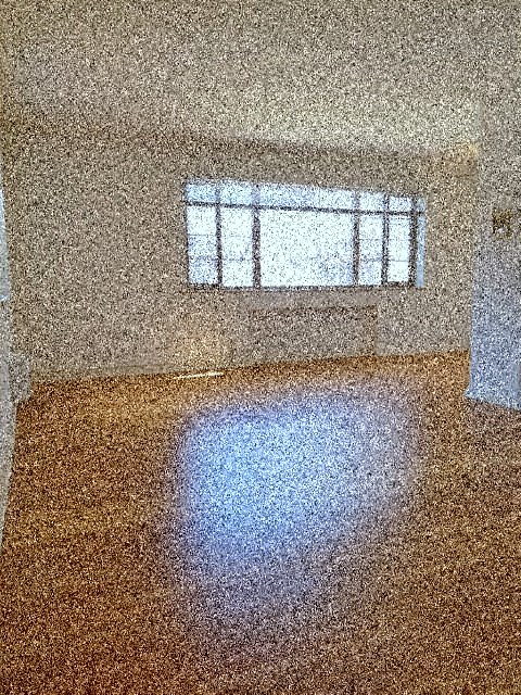 a reflection of a window on the floor of a room