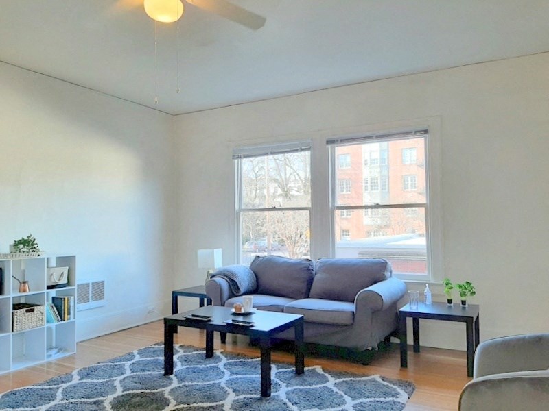 a living room with a couch and two tables