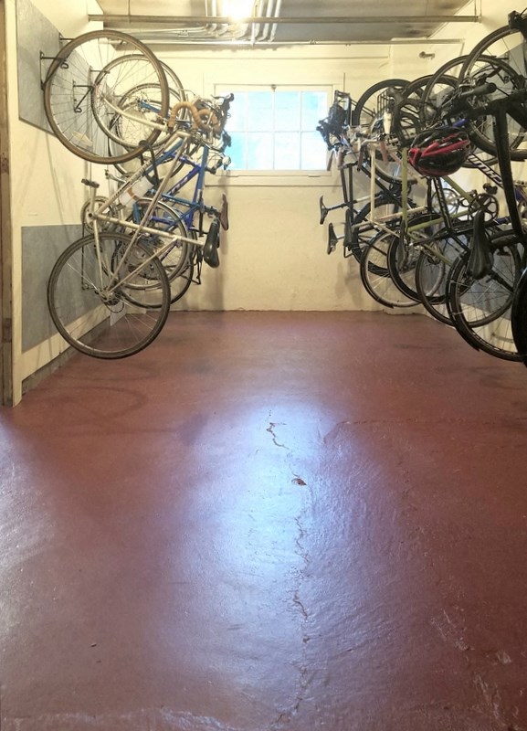a bunch of bikes parked in a room