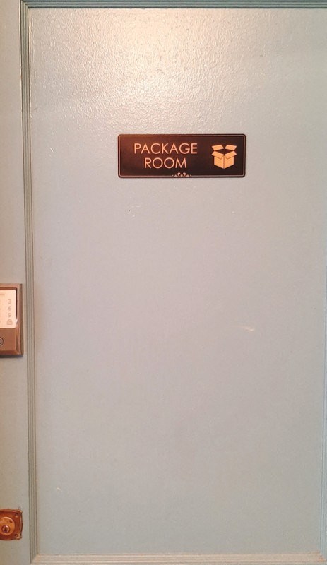 a door with a sign on it that says package room