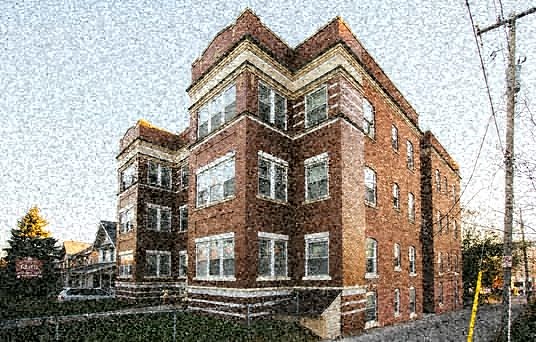 a red brick building on the side of a street