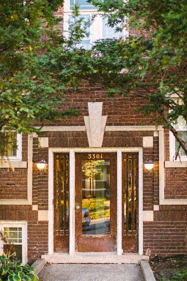 the front of a brick building with a door