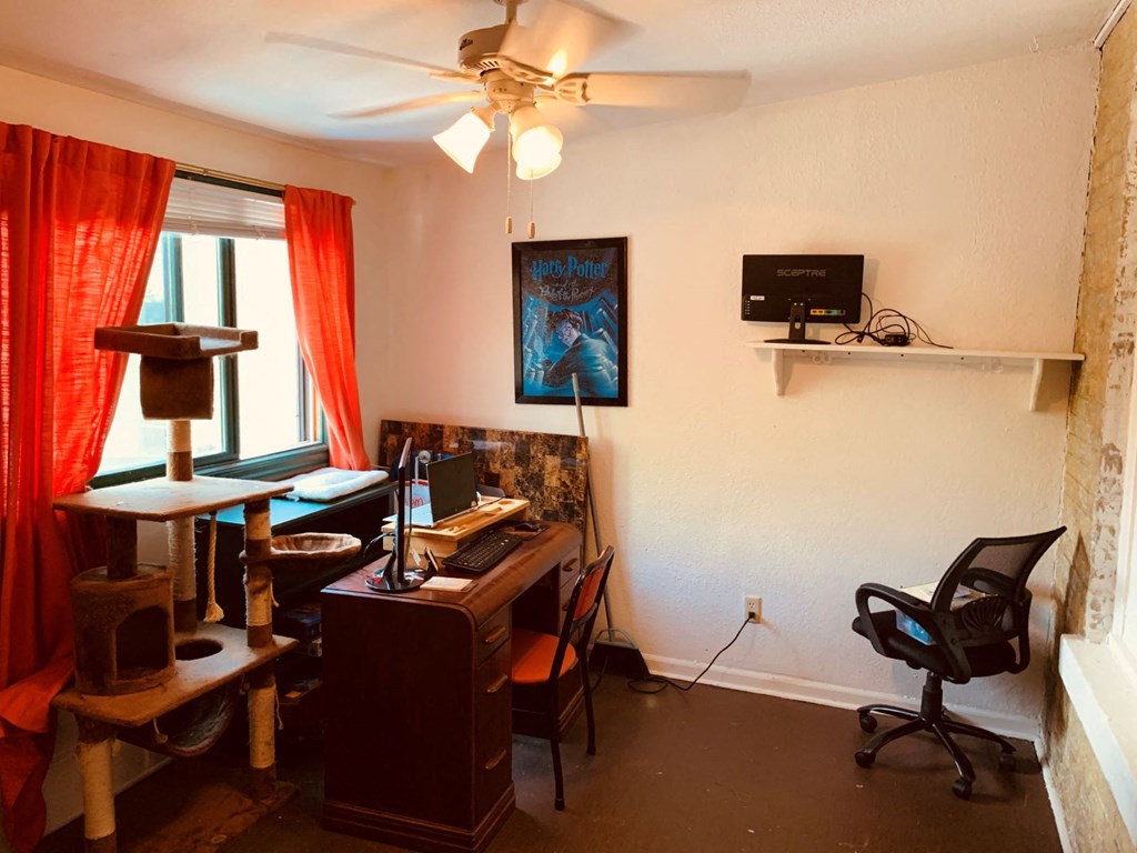 a home office with a desk and a computer