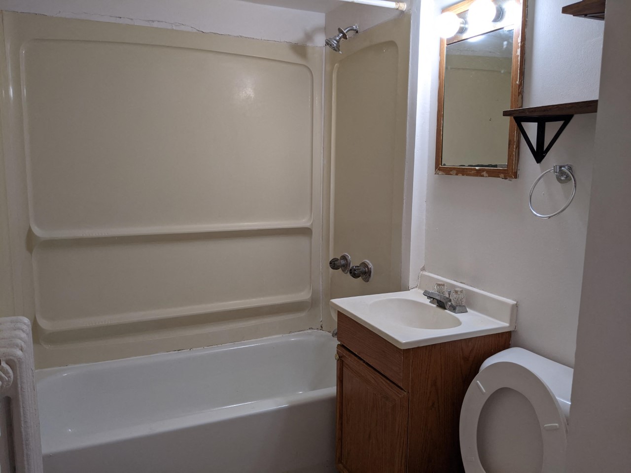 a bathroom with a toilet sink and a bath tub