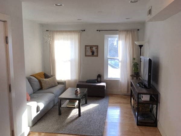 a living room with a couch and a television
