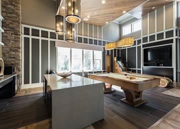 a large kitchen with a table and a tv