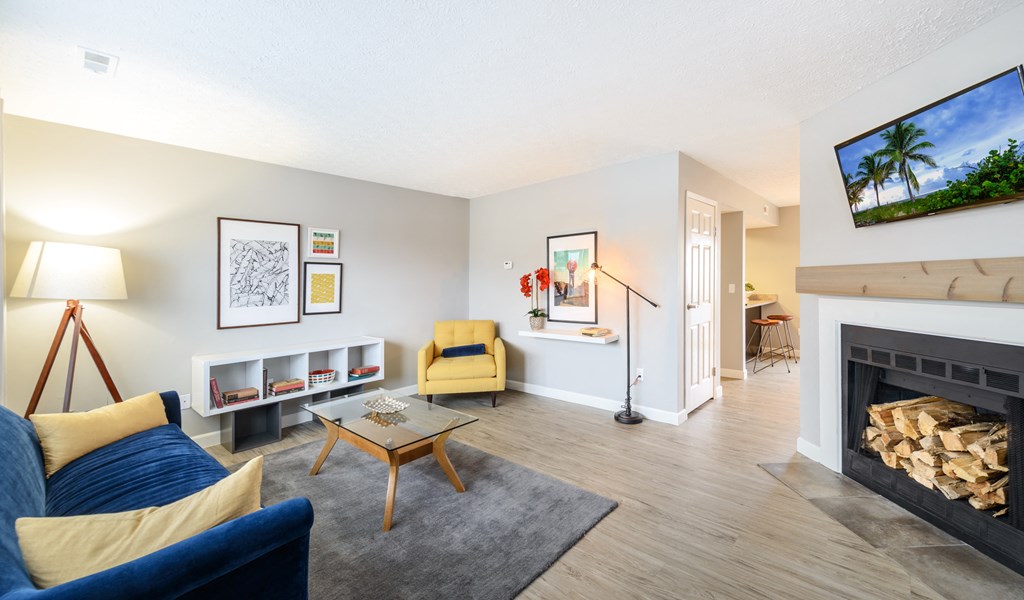 a living room with a fireplace and a couch