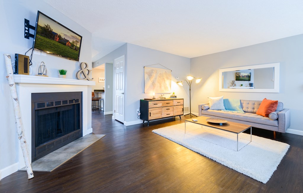 a living room with a fireplace and a couch